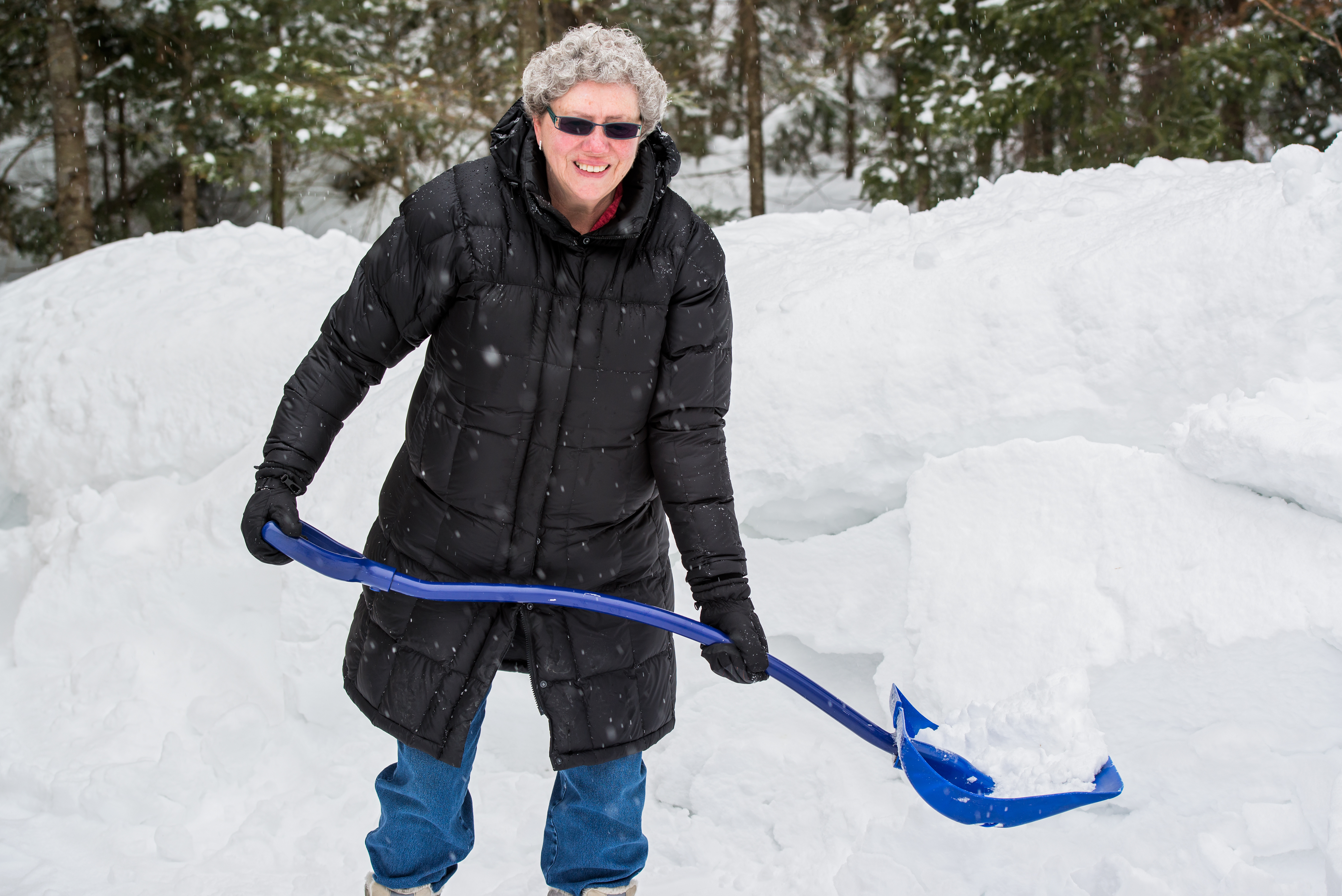 Old Woman Shovelling Snow