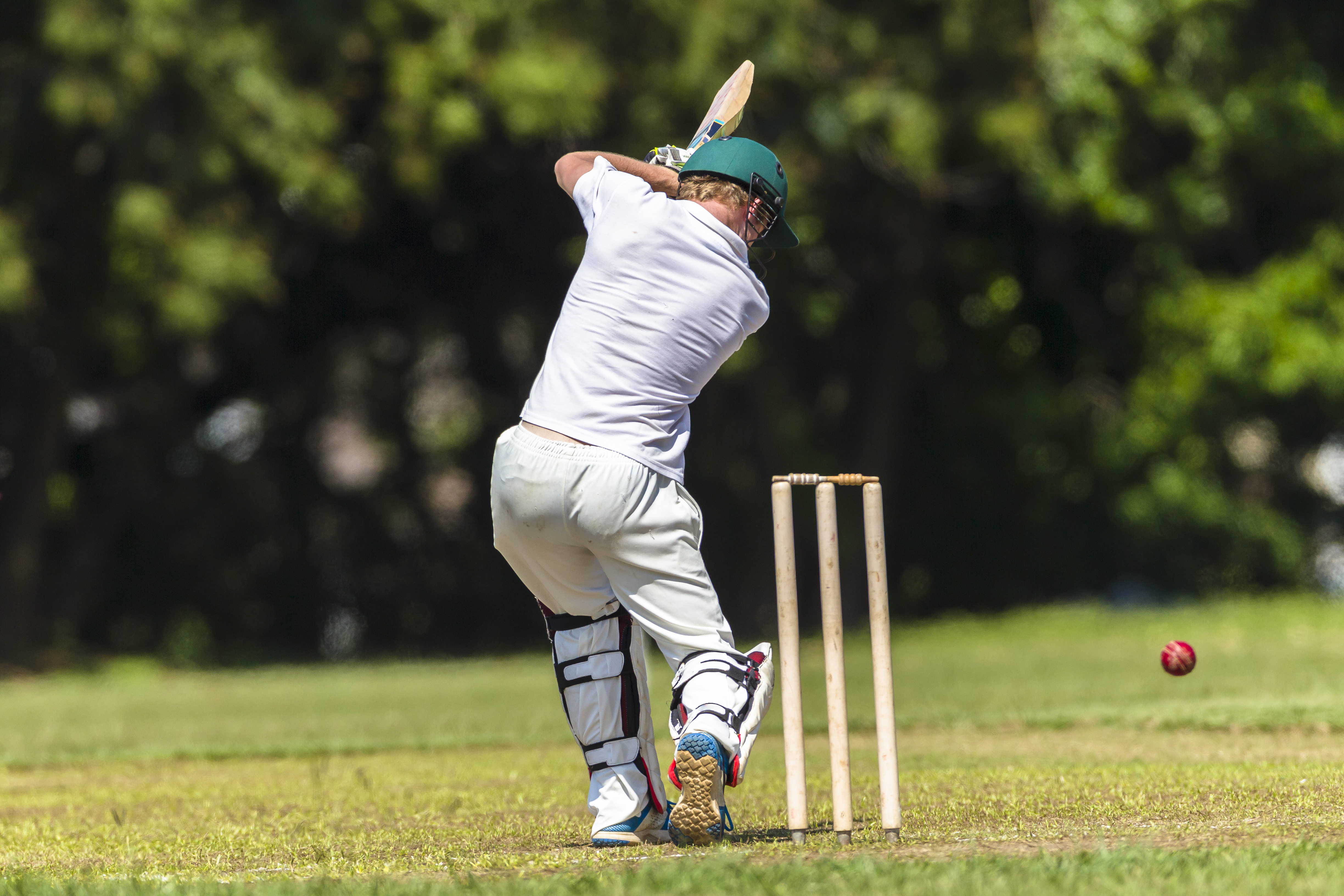 Young man playing cricket in the summer